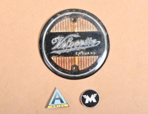 VELOCETTE: A circa 1960s plastic Velocette badge, together with two badge pins for Matchless and Ariel, the Velocette badge 8cm diameter