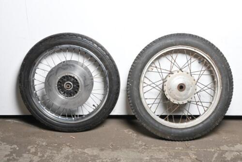 WHEELS: Two 19" wire motorcycle wheels with fitted tyres, the front tyre with fitted twin brake discs and numbered to hub "4 M 3910", tyre being 3.25 H19 and rear tyre being 3.50-19