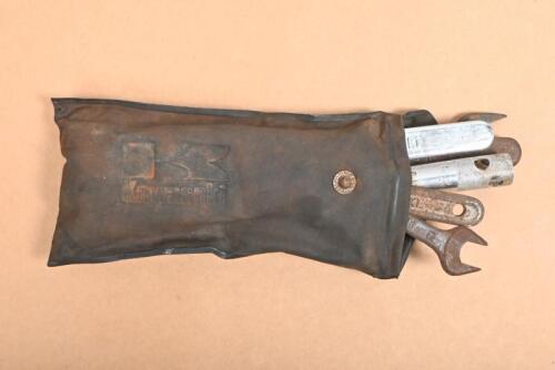 KAWASKI: A Kawaski tool kit pouch, including 6 various spanners, and a lug nut socket remover tool