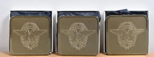 MATCHLESS: Three sets of six Matchless gilt metal drinks coasters with logo in laurel leaves