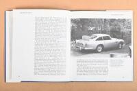 ASTON MARTIN: Two Aston Martin publications. 'ASTON MARTIN V8s' hardcover book by F.Wilson McComb & '1992 ASTON MARTIN REGISTER' as produced by the Aston Martin Owners Club - 2